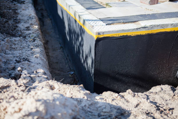 Professional Waterproofing technician working in Kings Park, VA